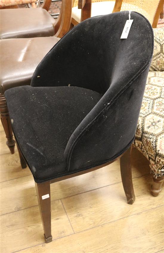 A black velvet tub frame side chair